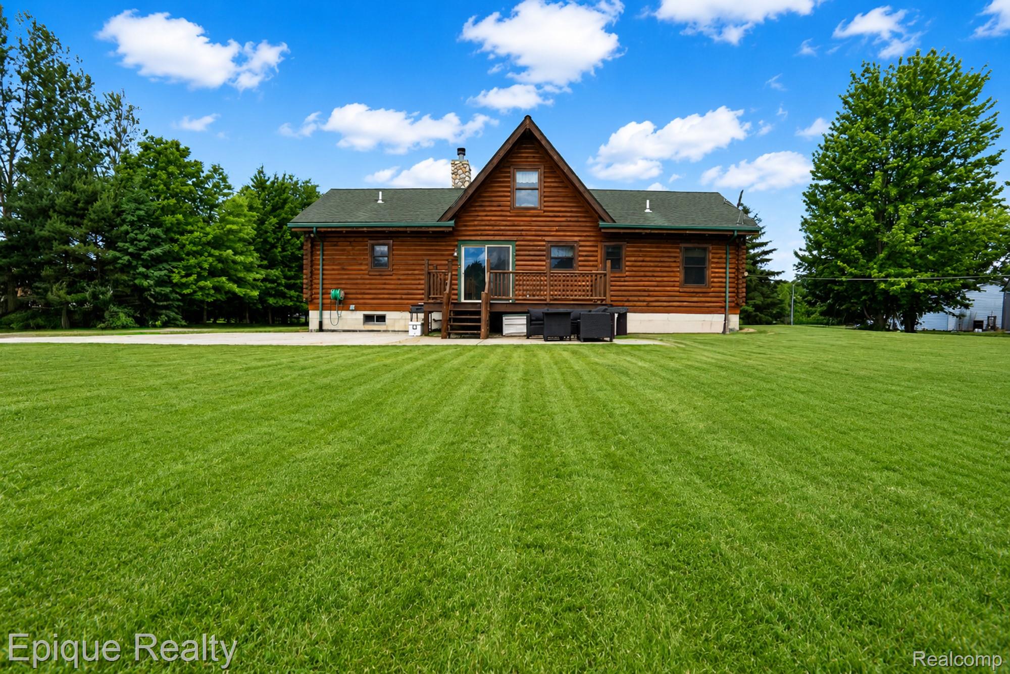 1966 Mayer Road Smiths Creek, MI 48074 - Photo 2 of 38 Log cabin style residence with an expansive lawn
