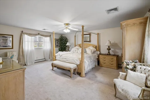 a bedroom with furniture and a couch