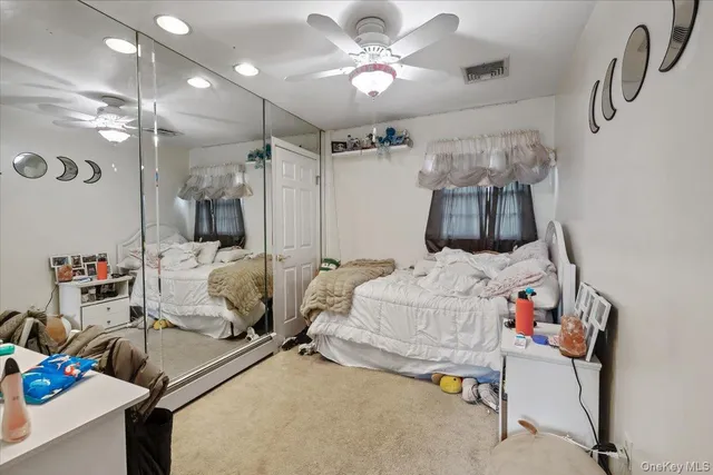 a bedroom with furniture and a chandelier