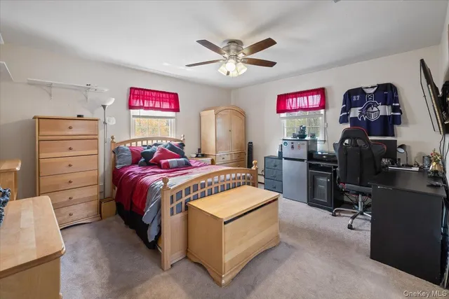 a bed room with a bed and a chandelier