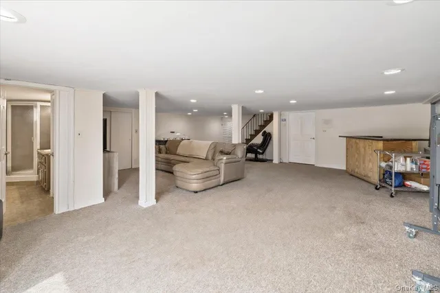 a view of a livingroom with furniture and a ceiling fan