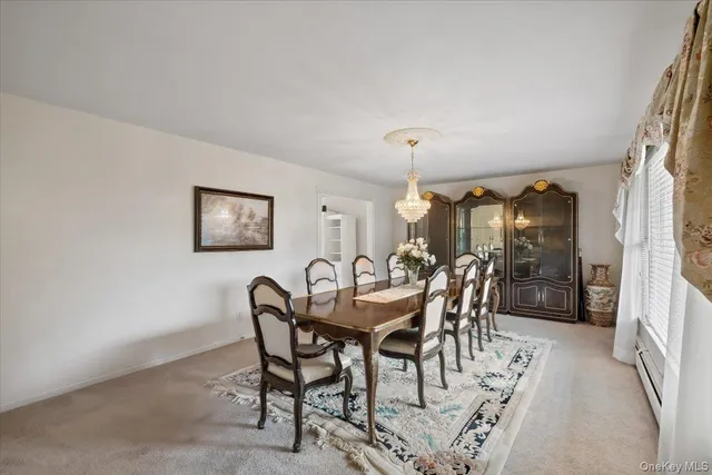 a dining room with furniture and window