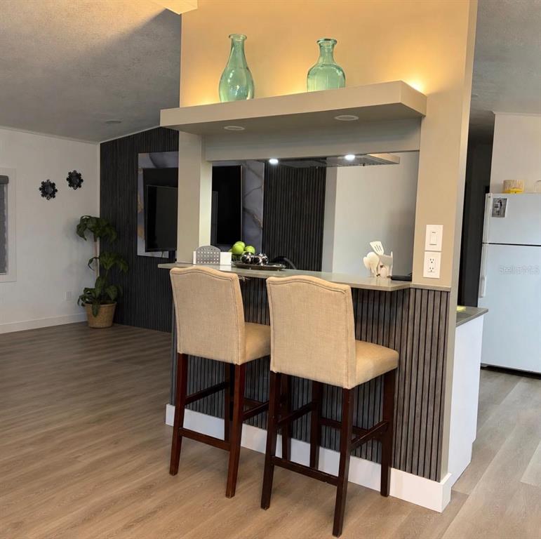 4 Eden Cemetery Road Frostproof, FL 33843 - Photo 8 of 15 a view of a dining room with furniture window and wooden floor