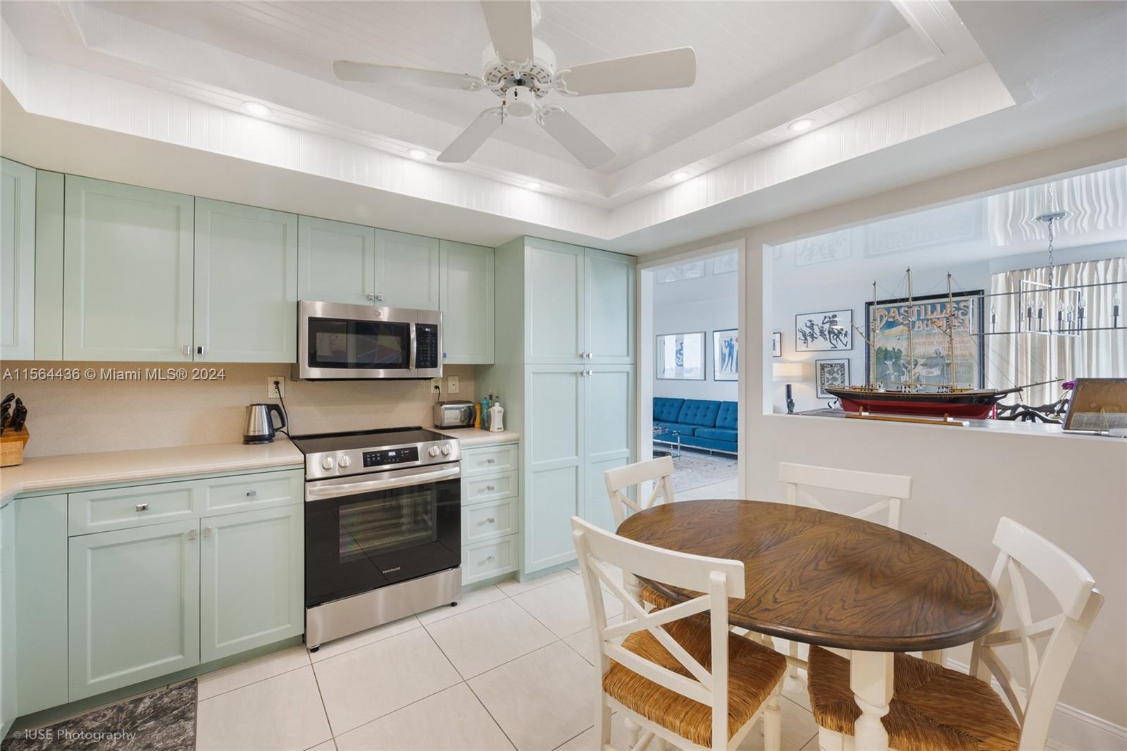 a kitchen with stainless steel appliances granite countertop a white cabinets sink and stove