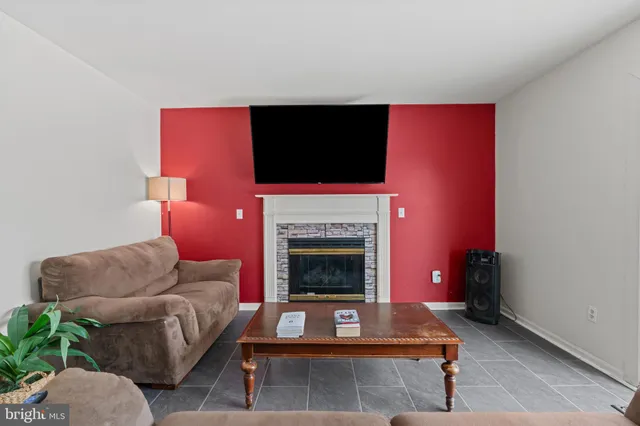 a view of a workspace with furniture and wooden floor