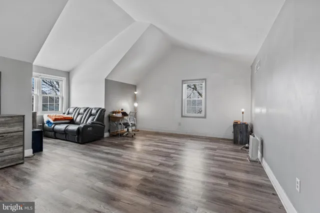 a bathroom with a toilet and a shower curtain