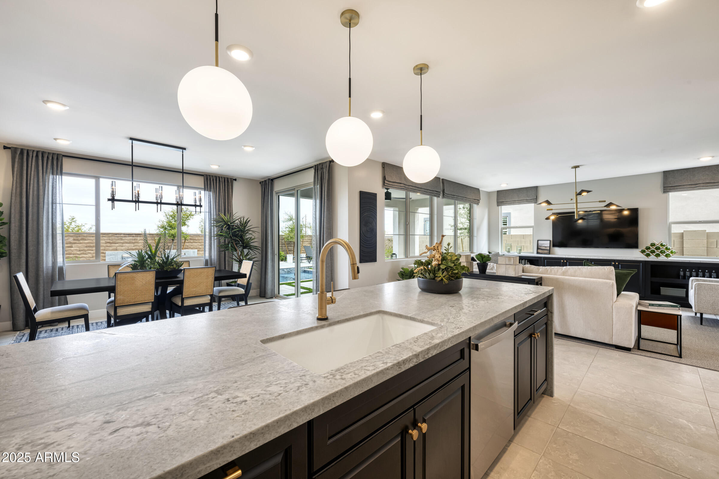 1526 East Coconino Way Gilbert, AZ 85298 - Photo 4 of 15 a kitchen with granite countertop a sink cabinets and living room view