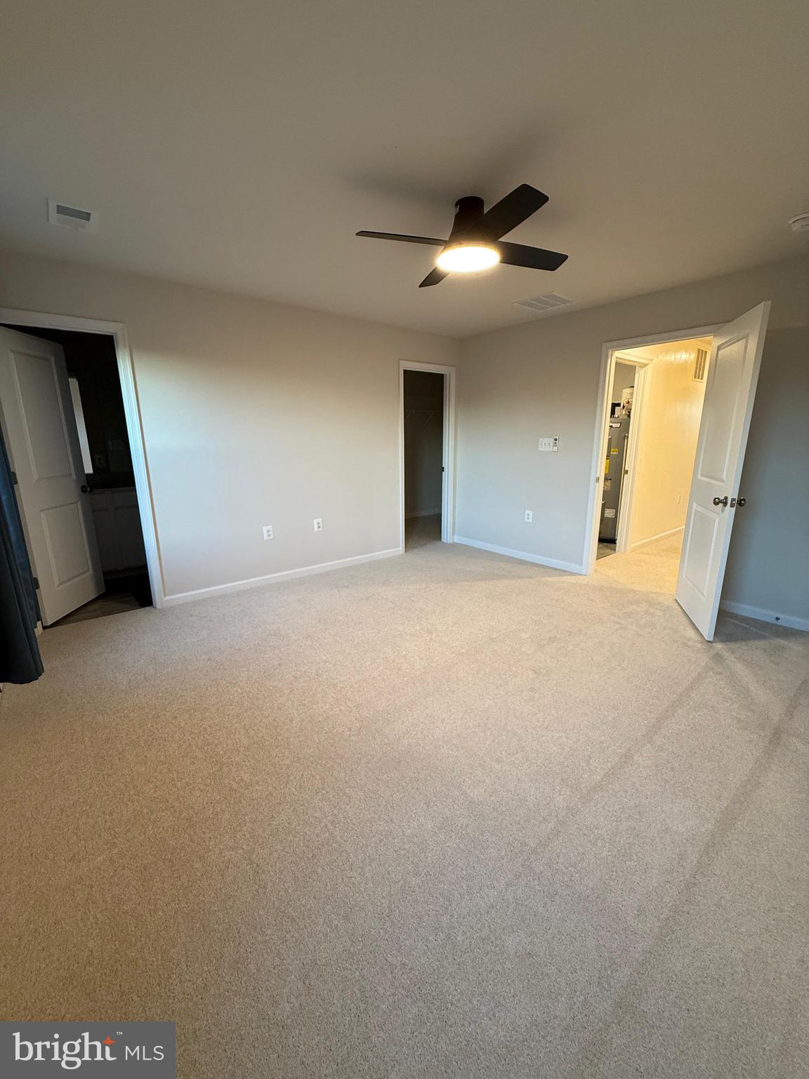 179 Olympus Road Charles Town, WV 25414 - Photo 12 of 26 a view of an empty room with a ceiling fan