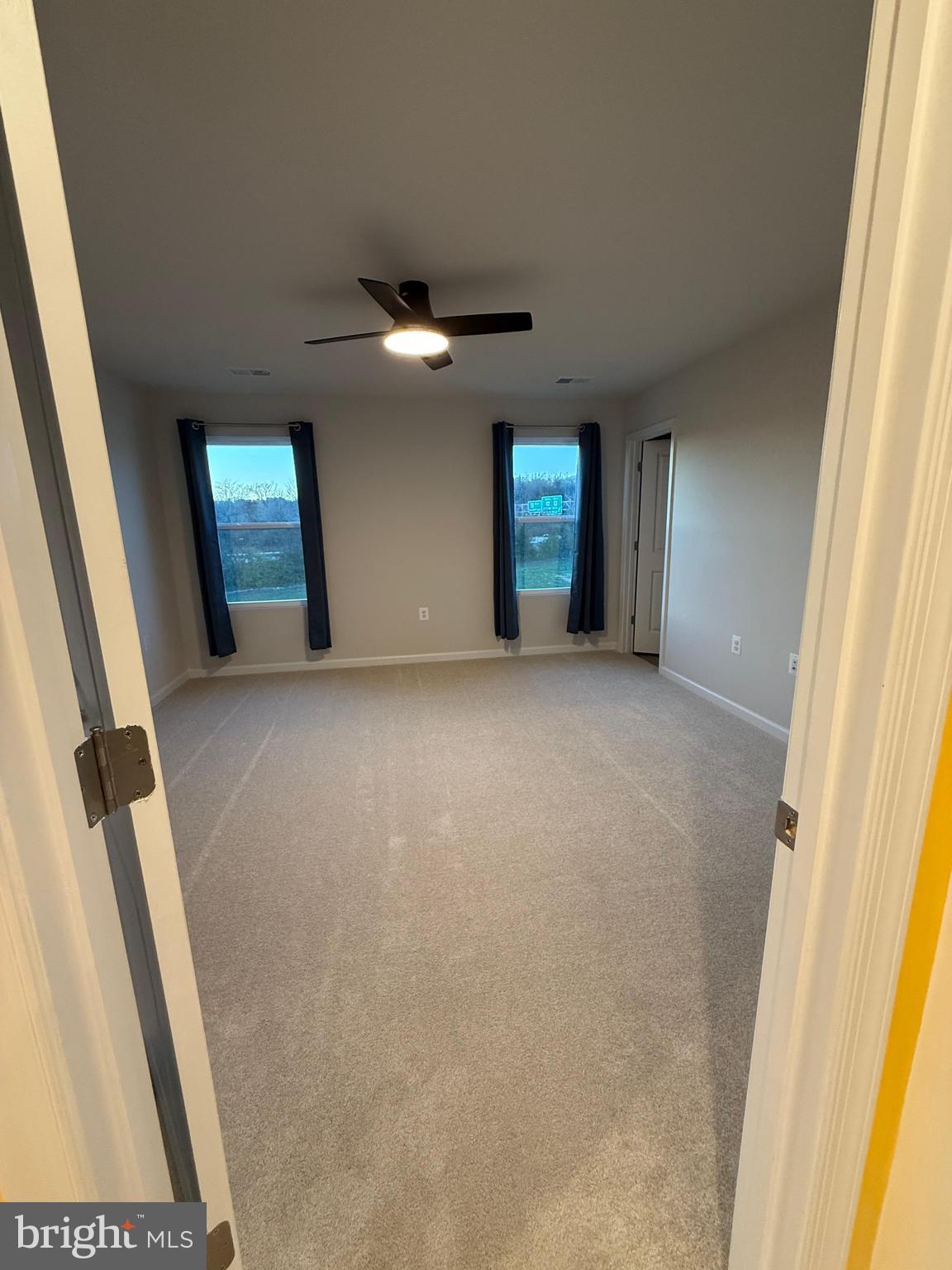 179 Olympus Road Charles Town, WV 25414 - Photo 13 of 26 an empty room with windows and cabinet