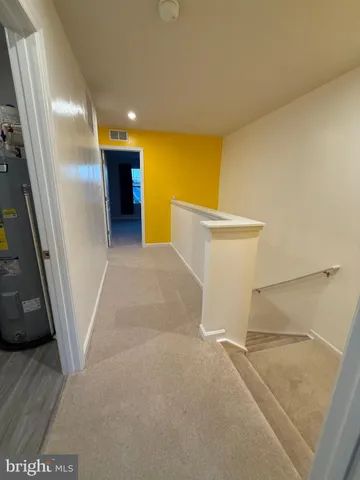 a view of a hallway with staircase