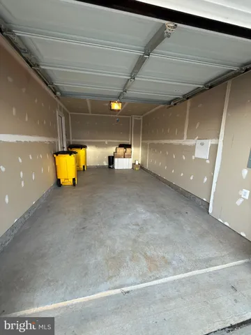a view of a room with wooden floor and a couch