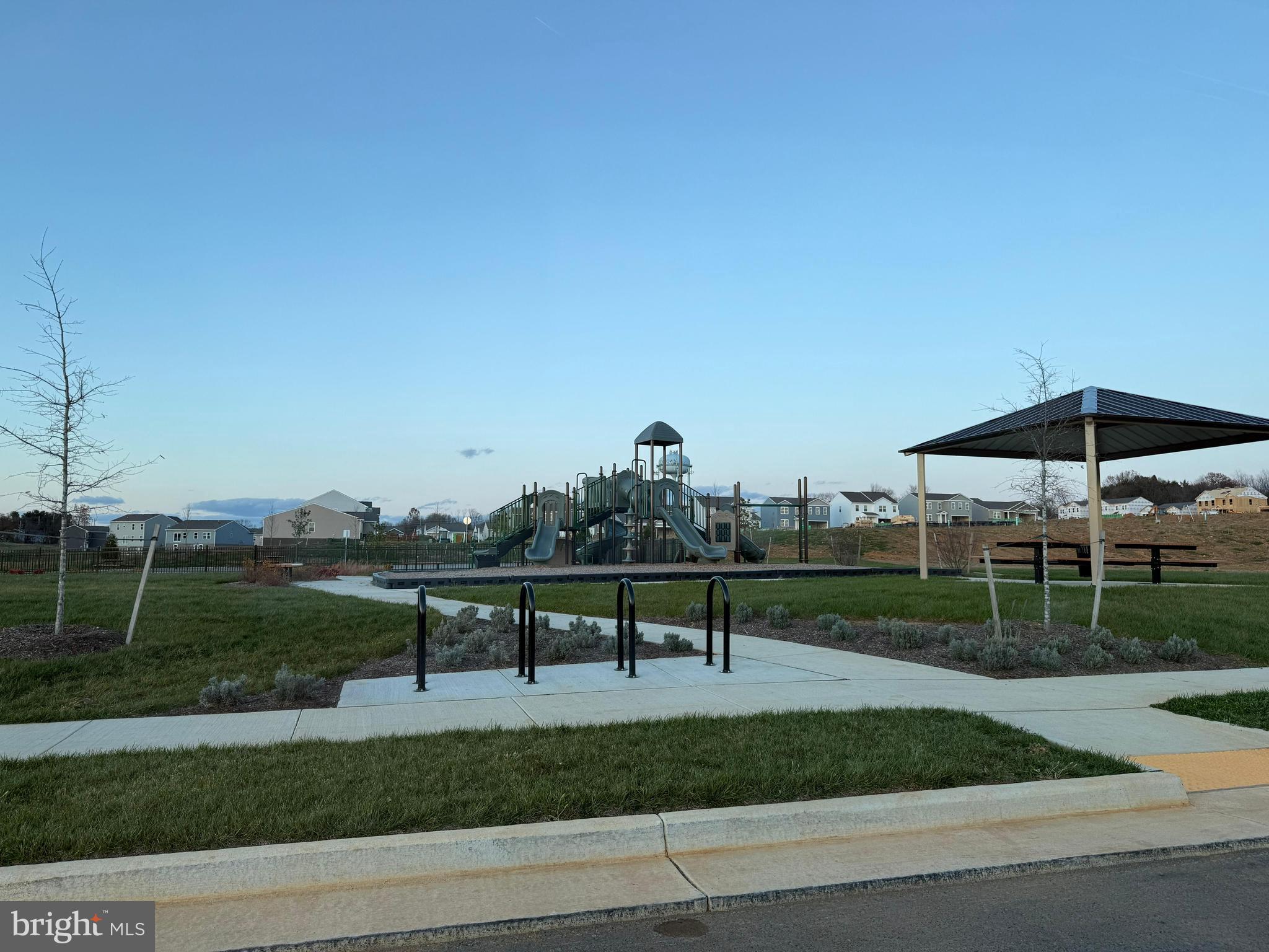 179 Olympus Road Charles Town, WV 25414 - Photo 26 of 26 a view of a bench in a garden