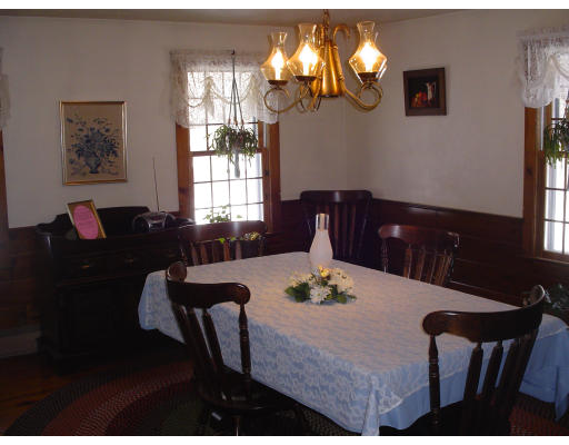 934 Piper Road Ashby, MA 01431 - Photo 3 of 10 a view of a dining room with furniture and chandelier