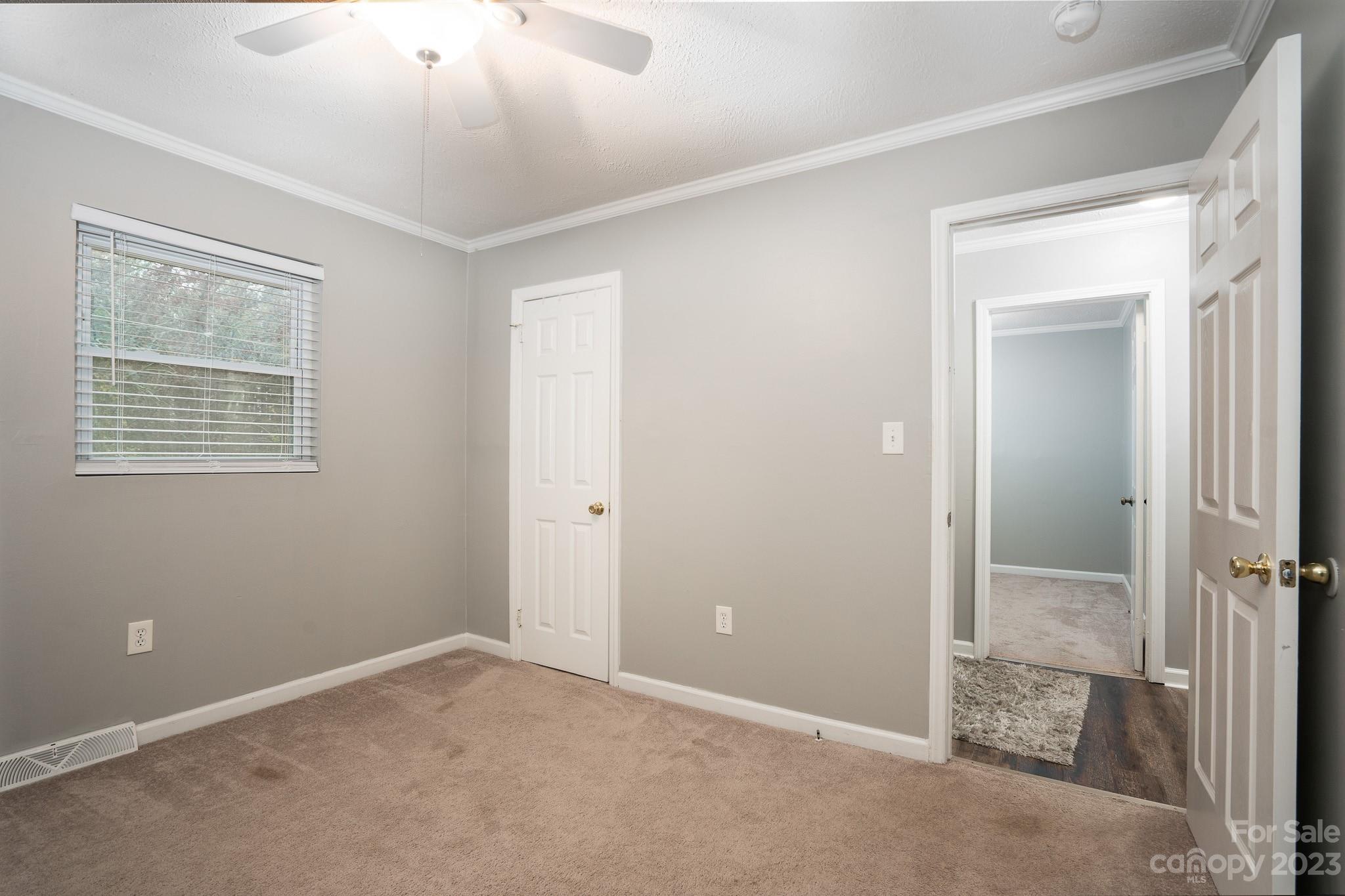 1250 B Street Mount Pleasant, NC 28124 - Photo 12 of 19 a view of an empty room with a mirror