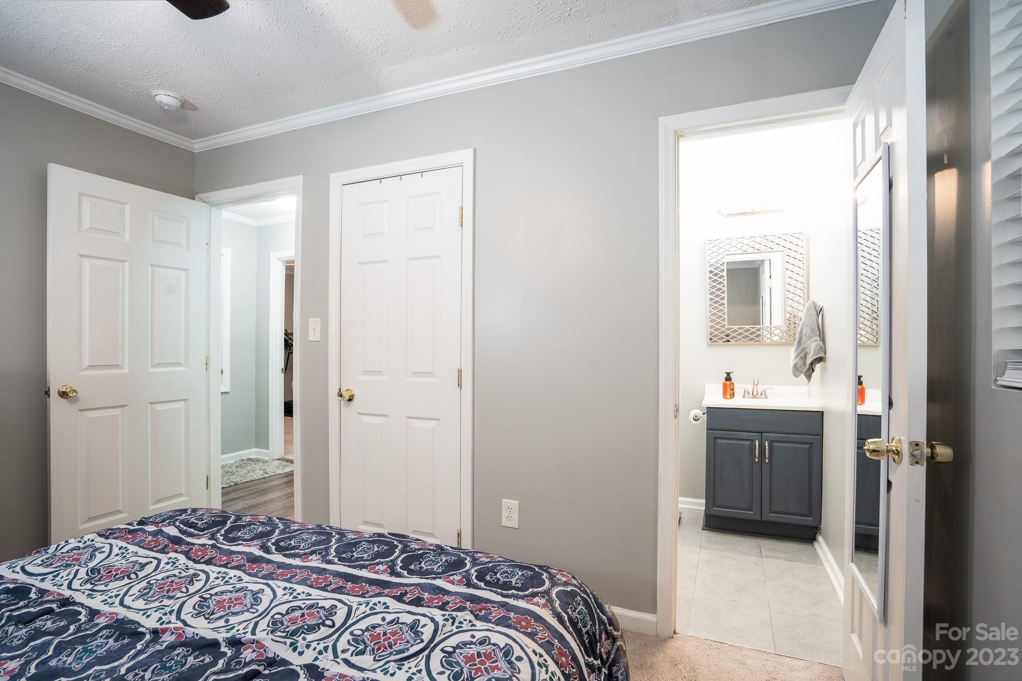 1250 B Street Mount Pleasant, NC 28124 - Photo 16 of 19 a bedroom with a bed and a mirror