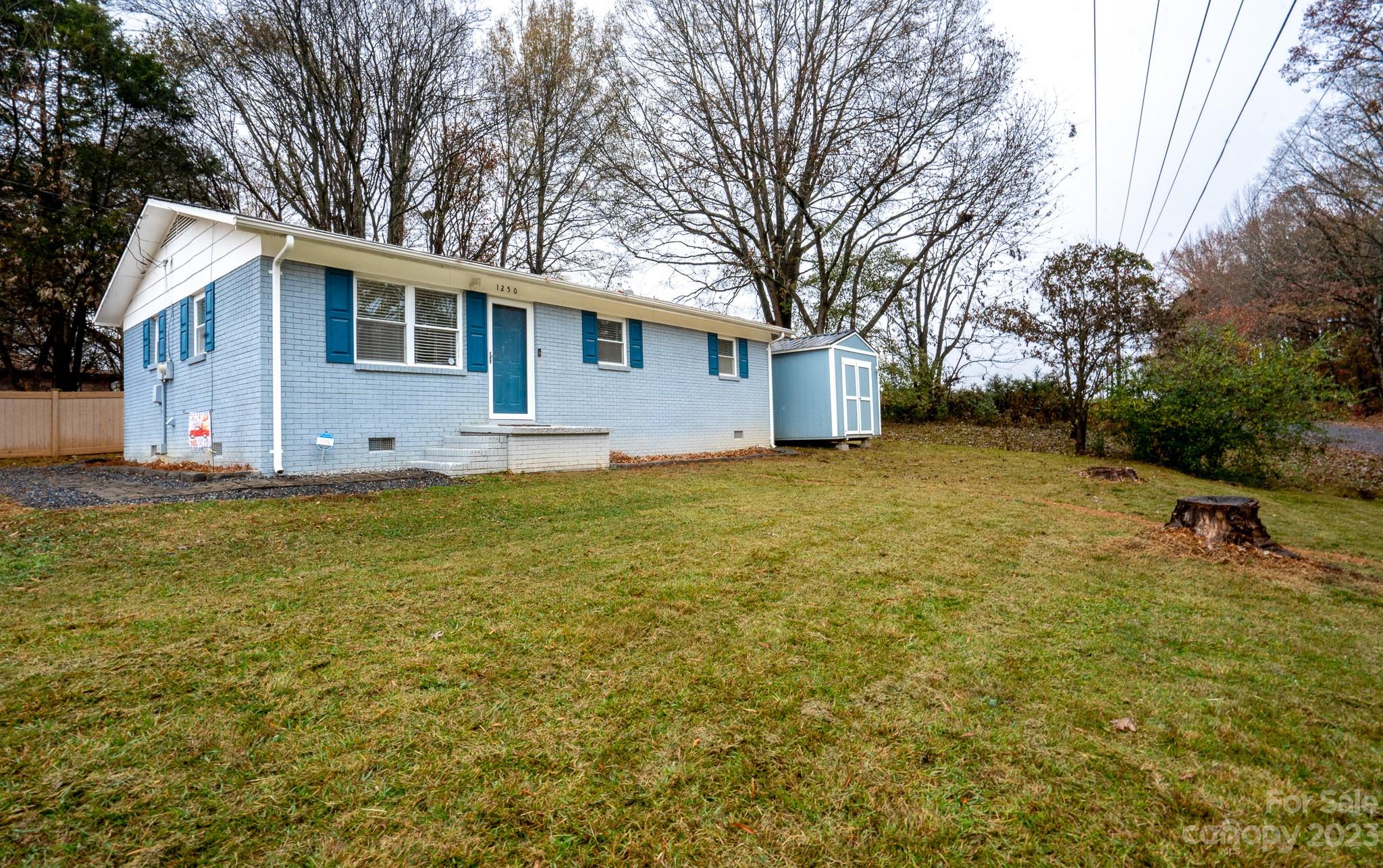 1250 B Street Mount Pleasant, NC 28124 - Photo 2 of 19 a view of a house with a yard