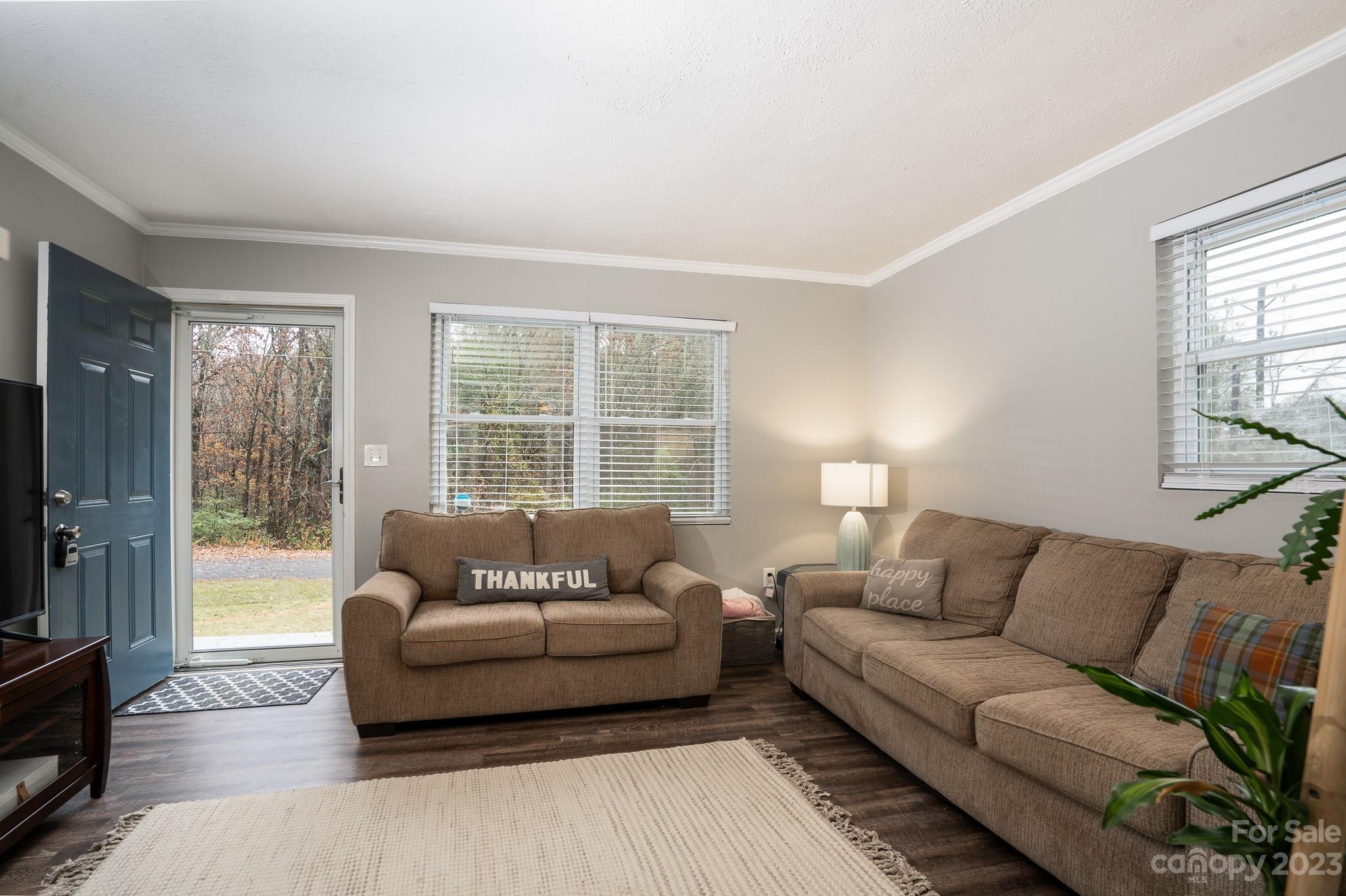 1250 B Street Mount Pleasant, NC 28124 - Photo 3 of 19 a living room with furniture and a flat screen tv