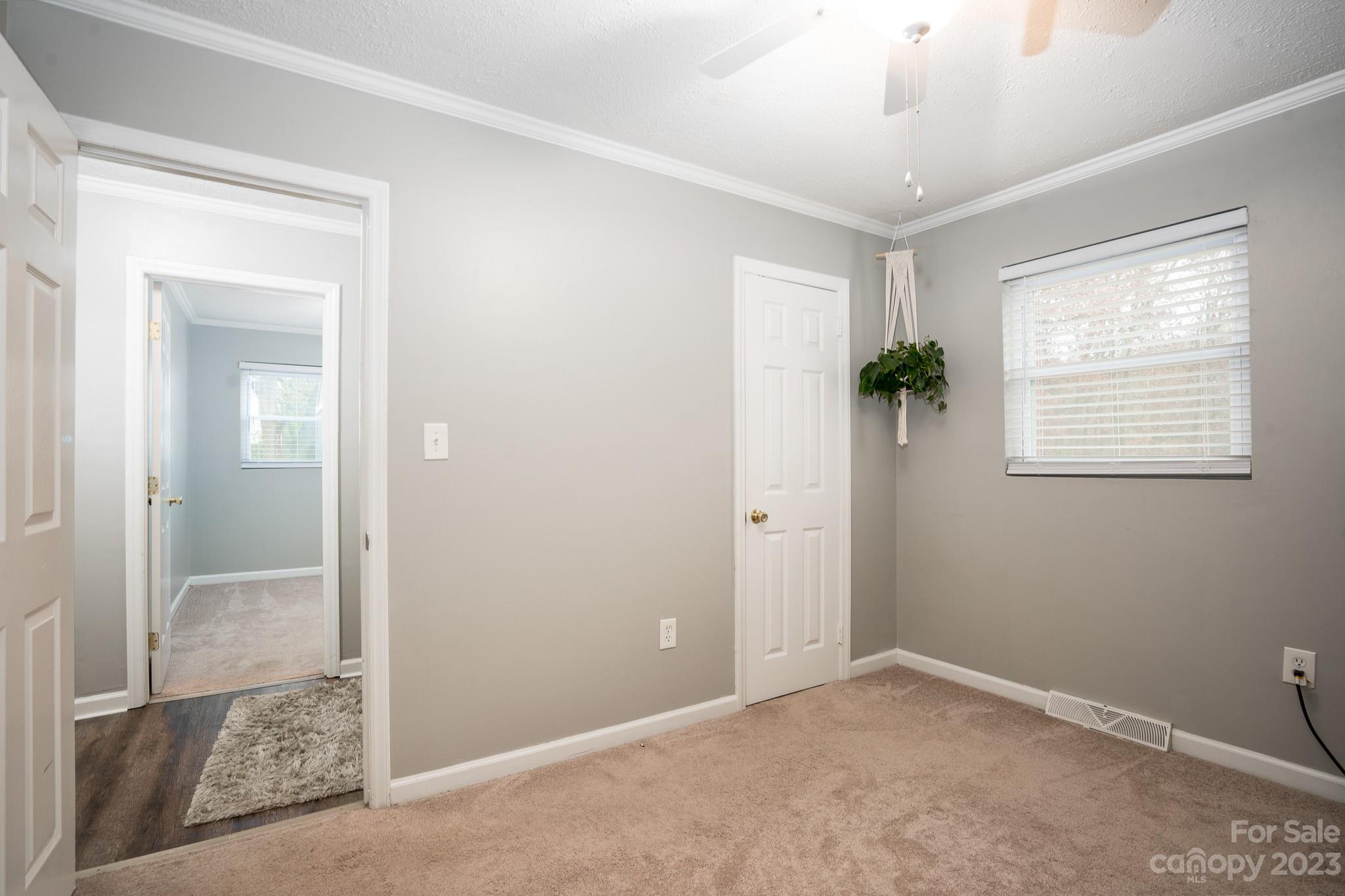 1250 B Street Mount Pleasant, NC 28124 - Photo 10 of 19 an empty room with windows and closet