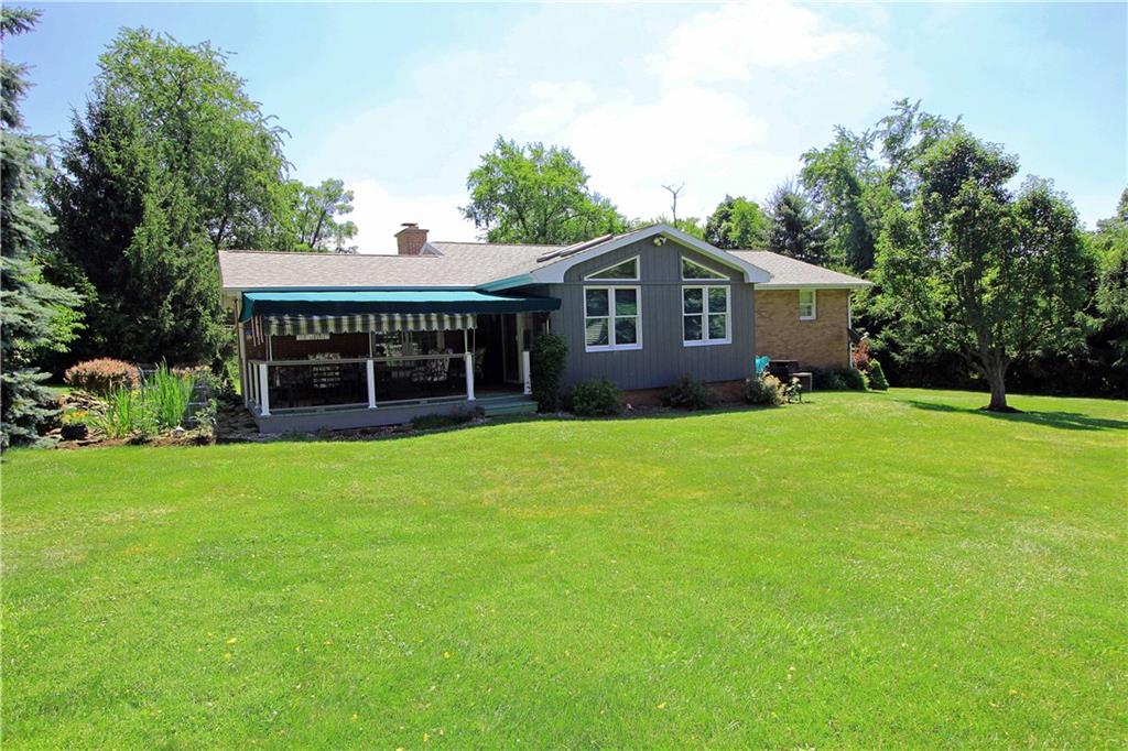 333 Linnwood Road Eighty Four, PA 15330 - Photo 25 of 25 VIEW FROM THE REAR YARD SHOWING THE COVERED DECK AND THE SUNROOM ADDITION