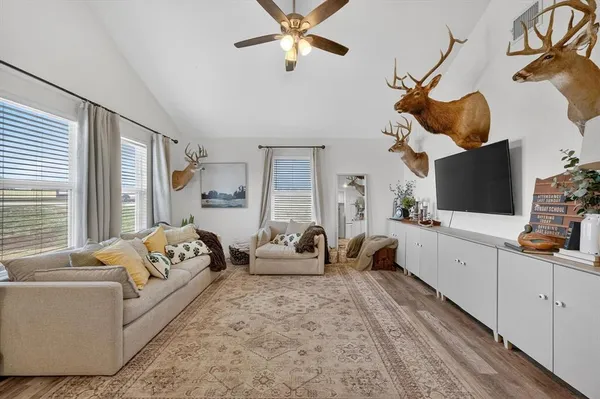 a living room with furniture and a flat screen tv