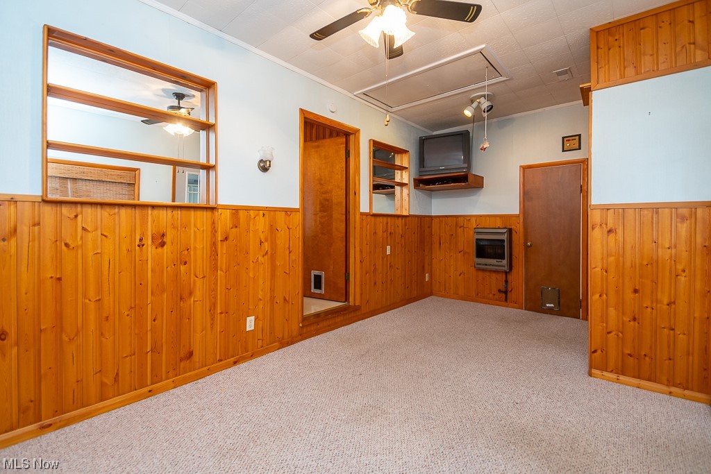 5 Pleasantview Vermilion, OH 44089 - Photo 11 of 37 Basement with wooden walls, ceiling fan, and light carpet