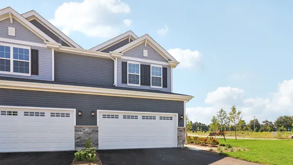a view of front of house with a yard