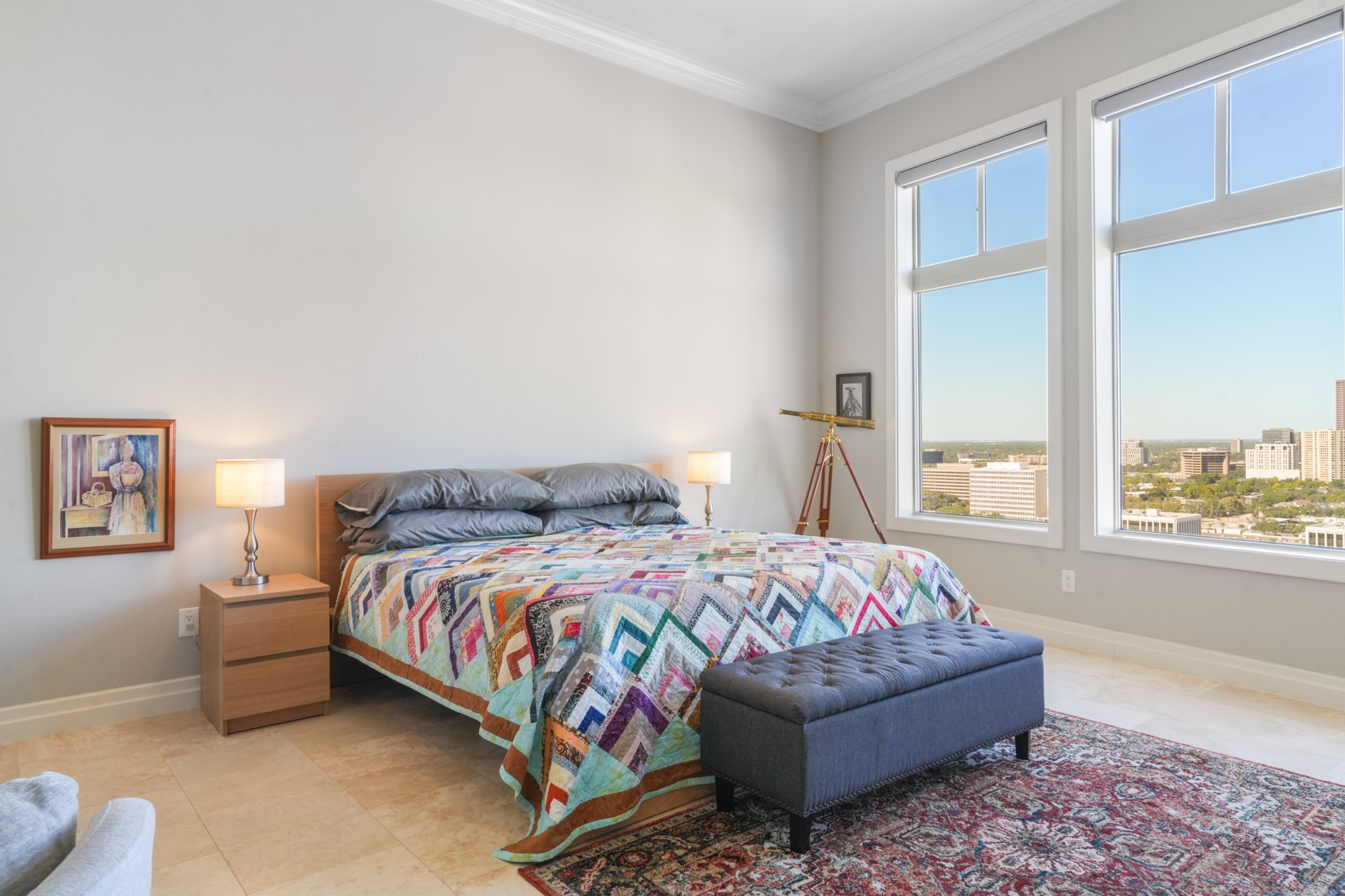 3388 Sage Road, Unit 2102 Houston, TX 77056 - Photo 14 of 21 Primary bedroom offers expansive windows with city views and a private bathroom.