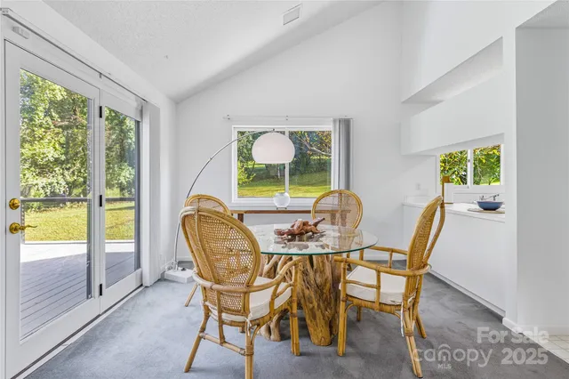 a view of a room with cabinets and wooden floor