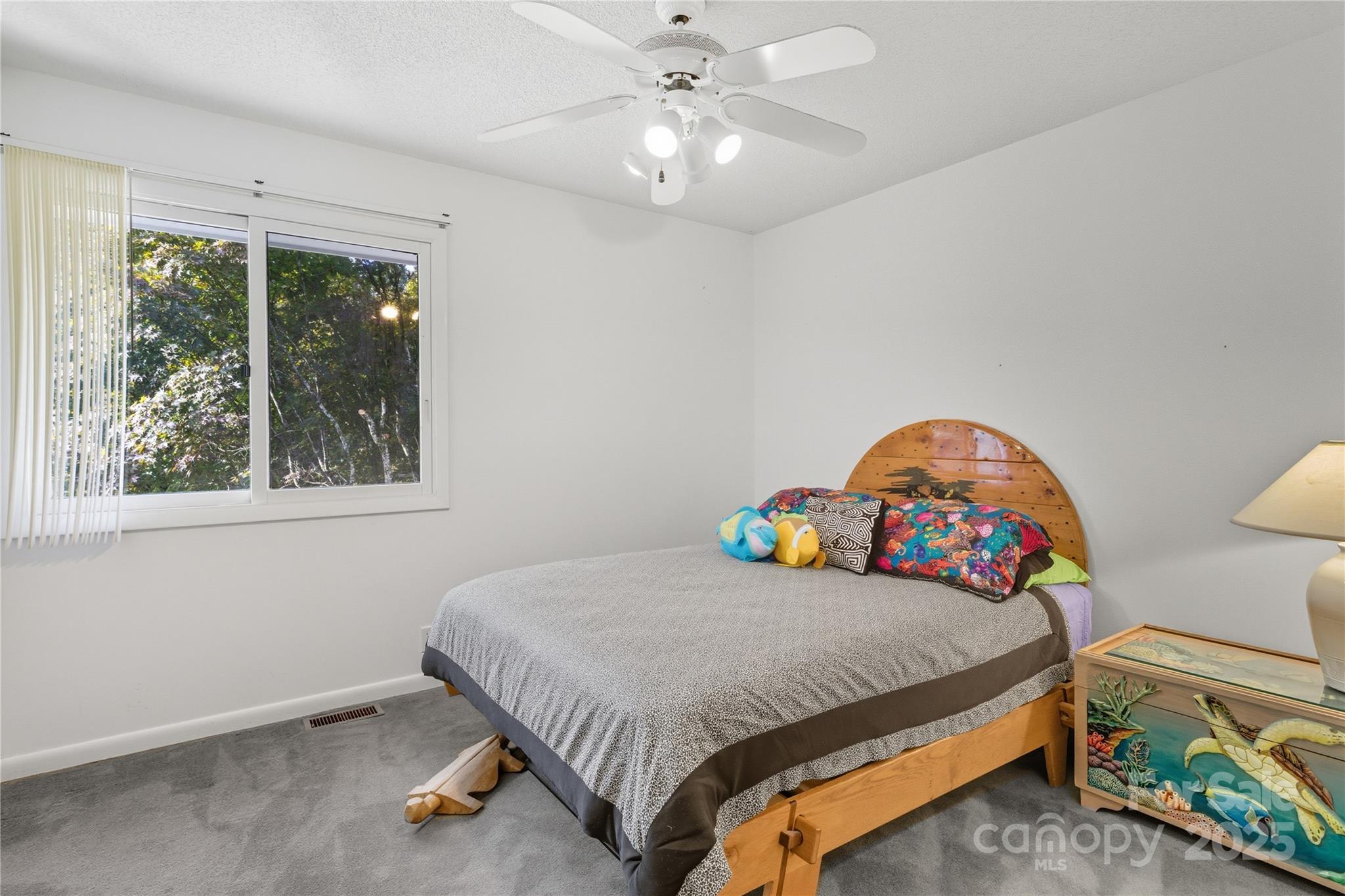 364 South Mills River Road Mills River, NC 28759 - Photo 22 of 47 a bedroom with a bed and a window