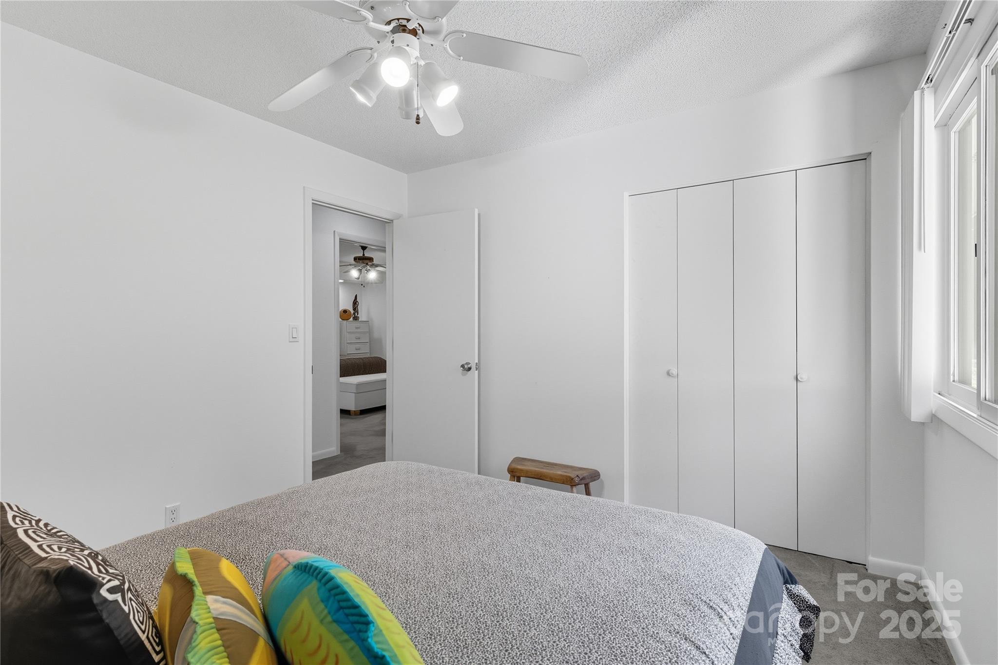 364 South Mills River Road Mills River, NC 28759 - Photo 23 of 47 a bedroom with a bed and a chandelier fan