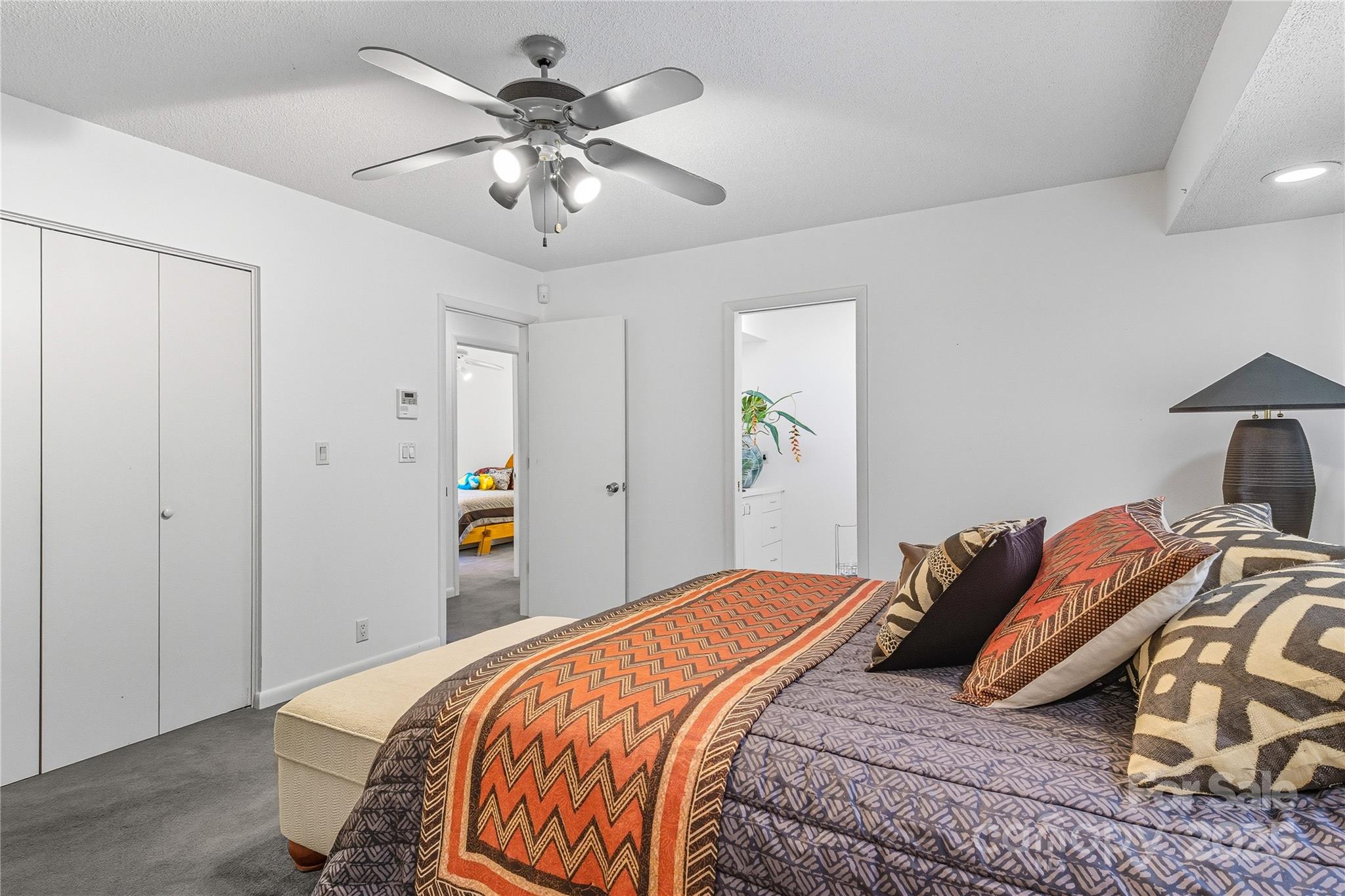 364 South Mills River Road Mills River, NC 28759 - Photo 27 of 47 a bedroom with a bed and a chandelier