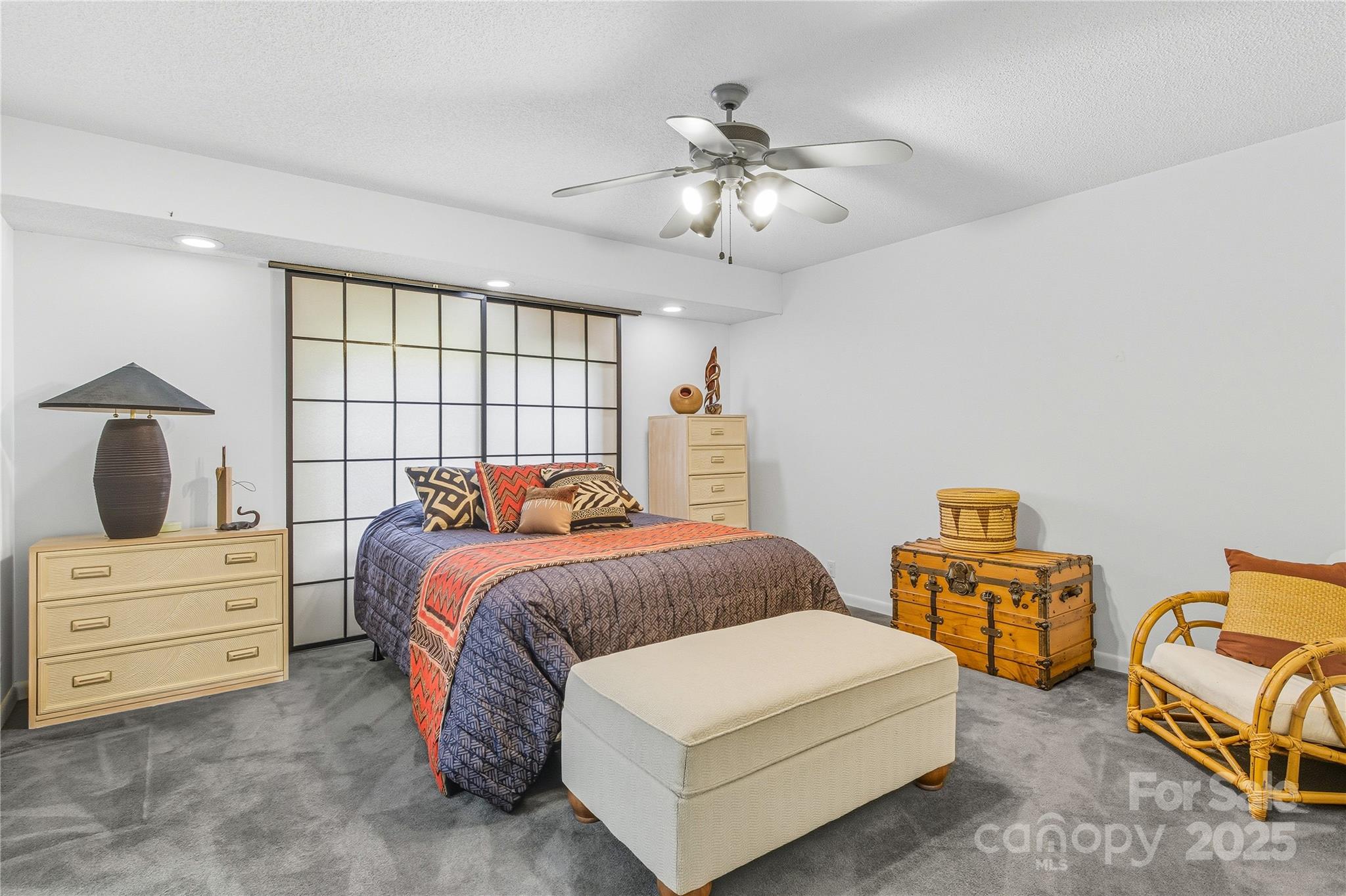 364 South Mills River Road Mills River, NC 28759 - Photo 28 of 47 a bedroom with a bed and a chandelier
