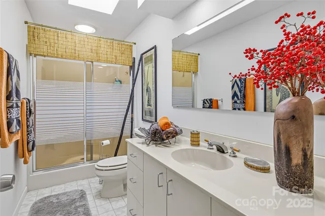 a bath room with a bathtub and a window