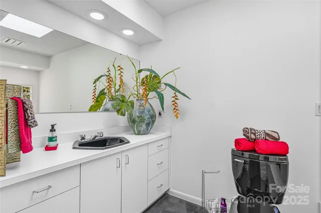 a bathroom with a bathtub and window