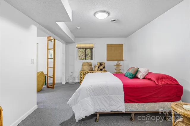 a bedroom with a bed and furniture