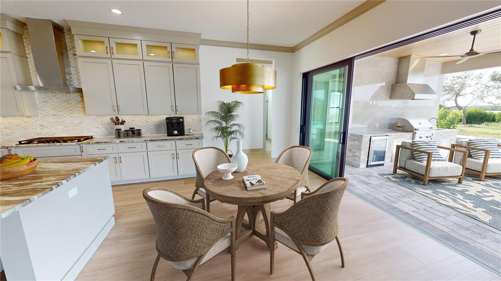 2033 Treasure Lane Punta Gorda, FL 33982 - Photo 18 of 63 a kitchen with a table and chairs in it