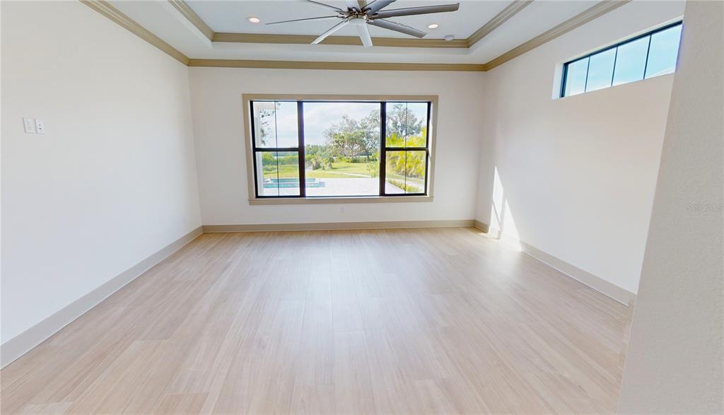 2033 Treasure Lane Punta Gorda, FL 33982 - Photo 20 of 63 wooden floor in an empty room with a window