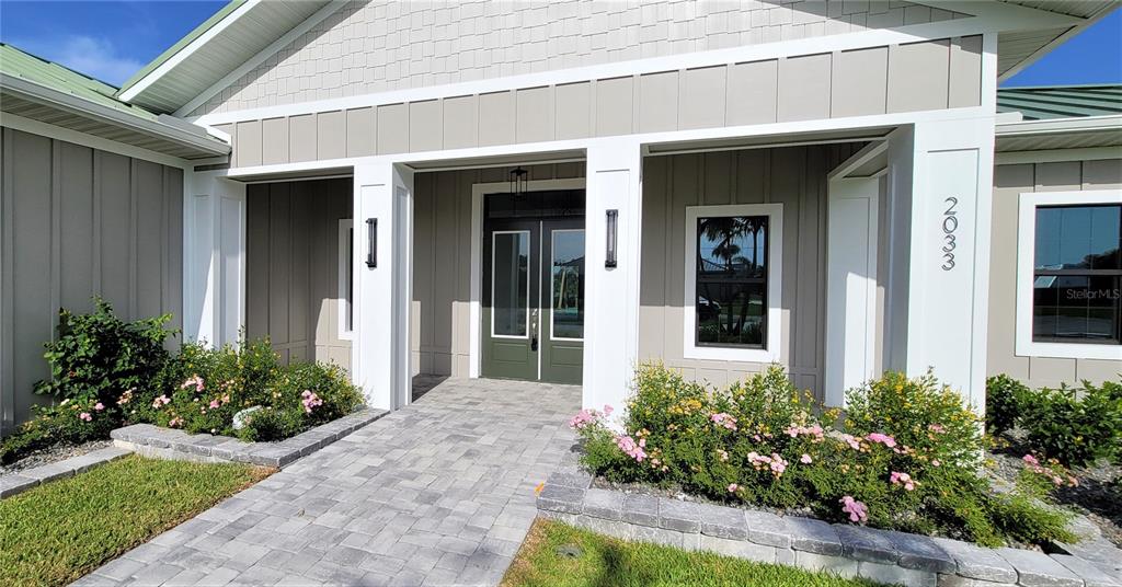 2033 Treasure Lane Punta Gorda, FL 33982 - Photo 3 of 63 a view of a bunch of flowers in front of house