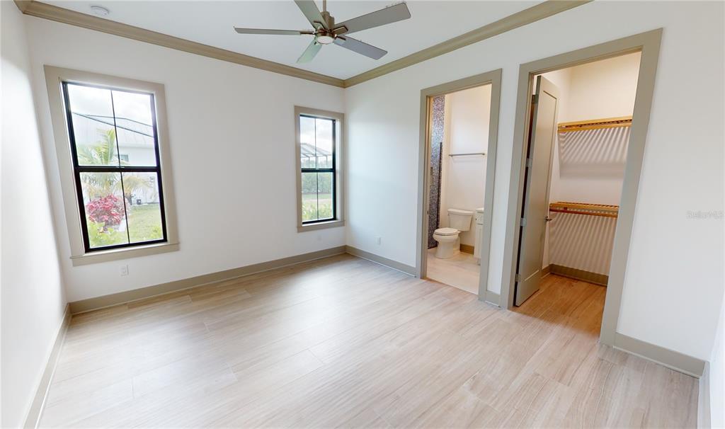 2033 Treasure Lane Punta Gorda, FL 33982 - Photo 31 of 63 a view of an empty room with a window and wooden floor