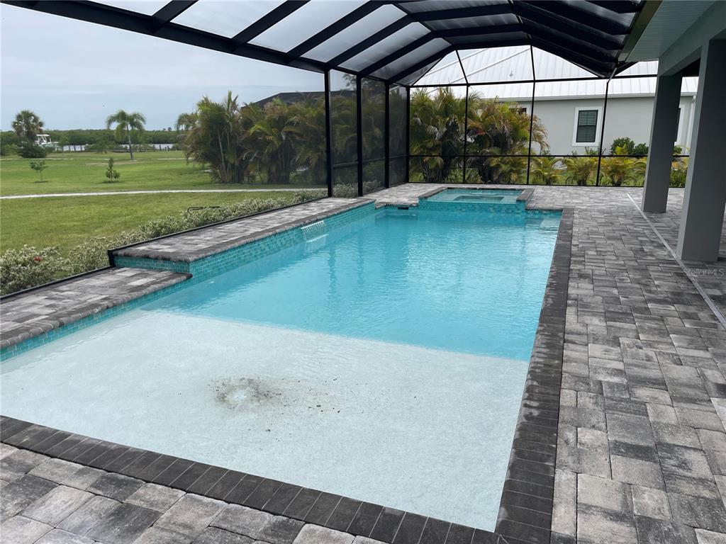 2033 Treasure Lane Punta Gorda, FL 33982 - Photo 47 of 63 a view of a swimming pool with a porch