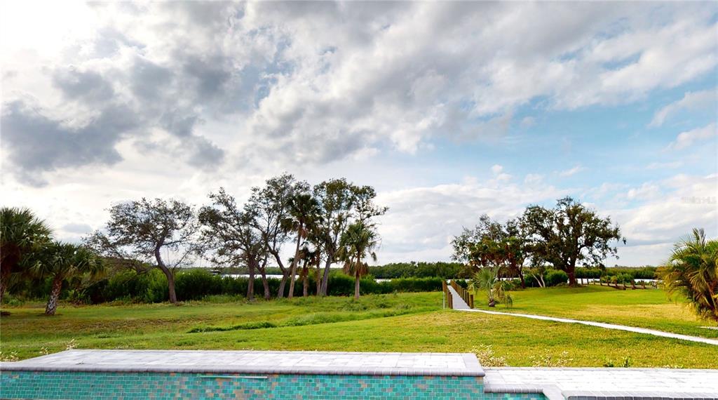 2033 Treasure Lane Punta Gorda, FL 33982 - Photo 49 of 63 a view of a golf course with a trees