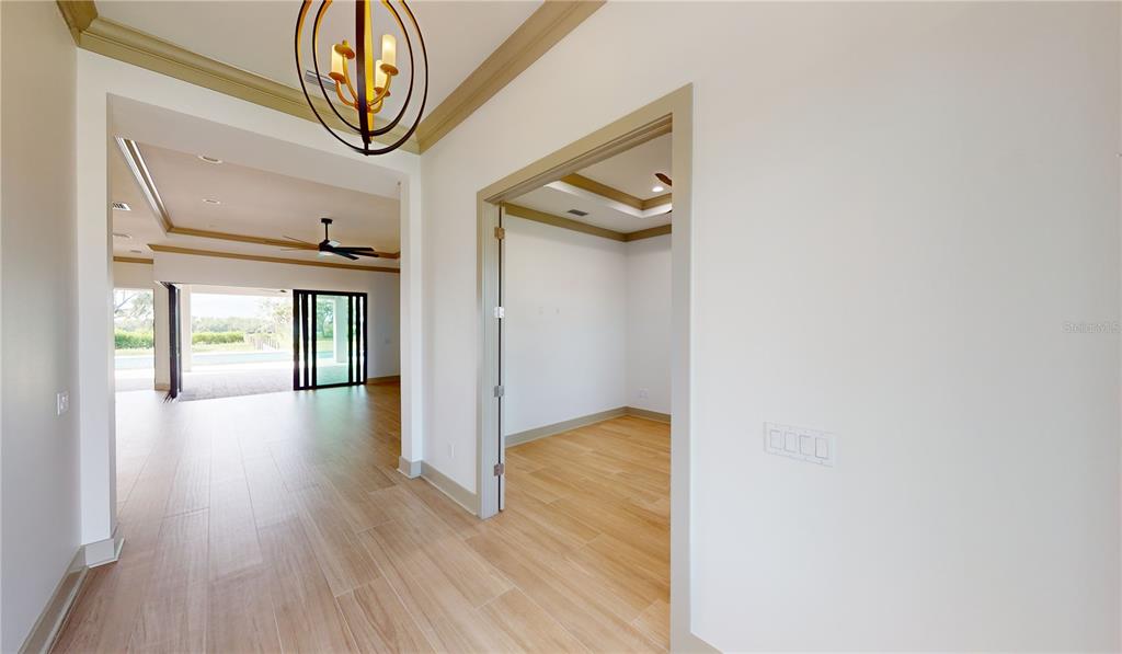 2033 Treasure Lane Punta Gorda, FL 33982 - Photo 6 of 63 a view of hallway with wooden floor