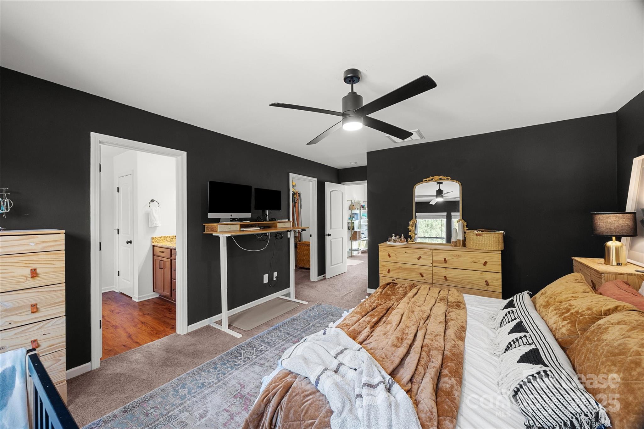 1668 Beleek Ridge Lane Clover, SC 29710 - Photo 16 of 42 a bedroom with a bed and a flat screen tv