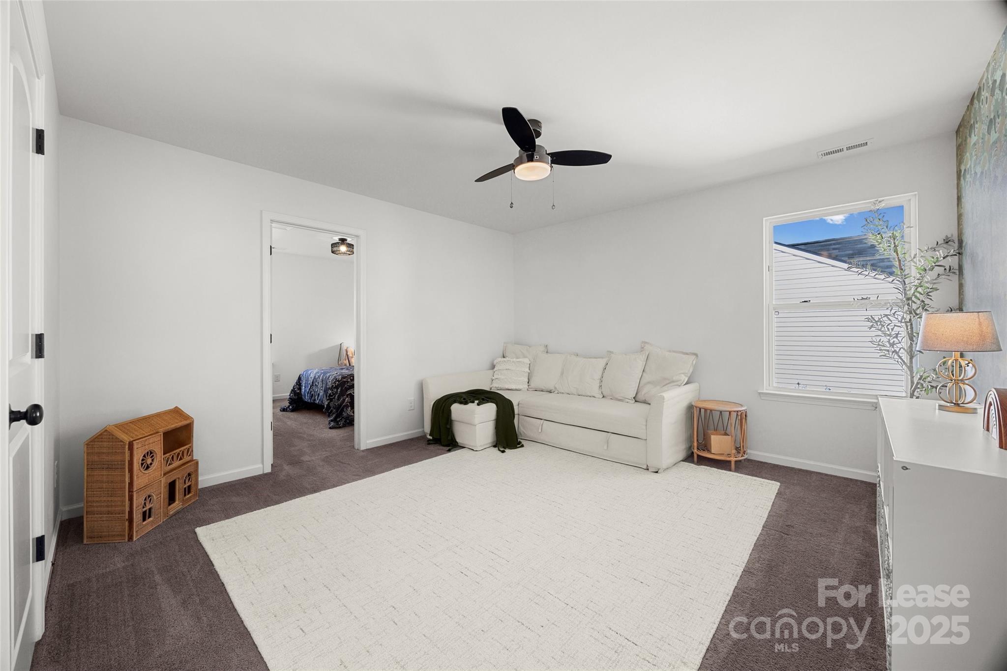 1668 Beleek Ridge Lane Clover, SC 29710 - Photo 20 of 42 a bedroom with furniture and a lamp