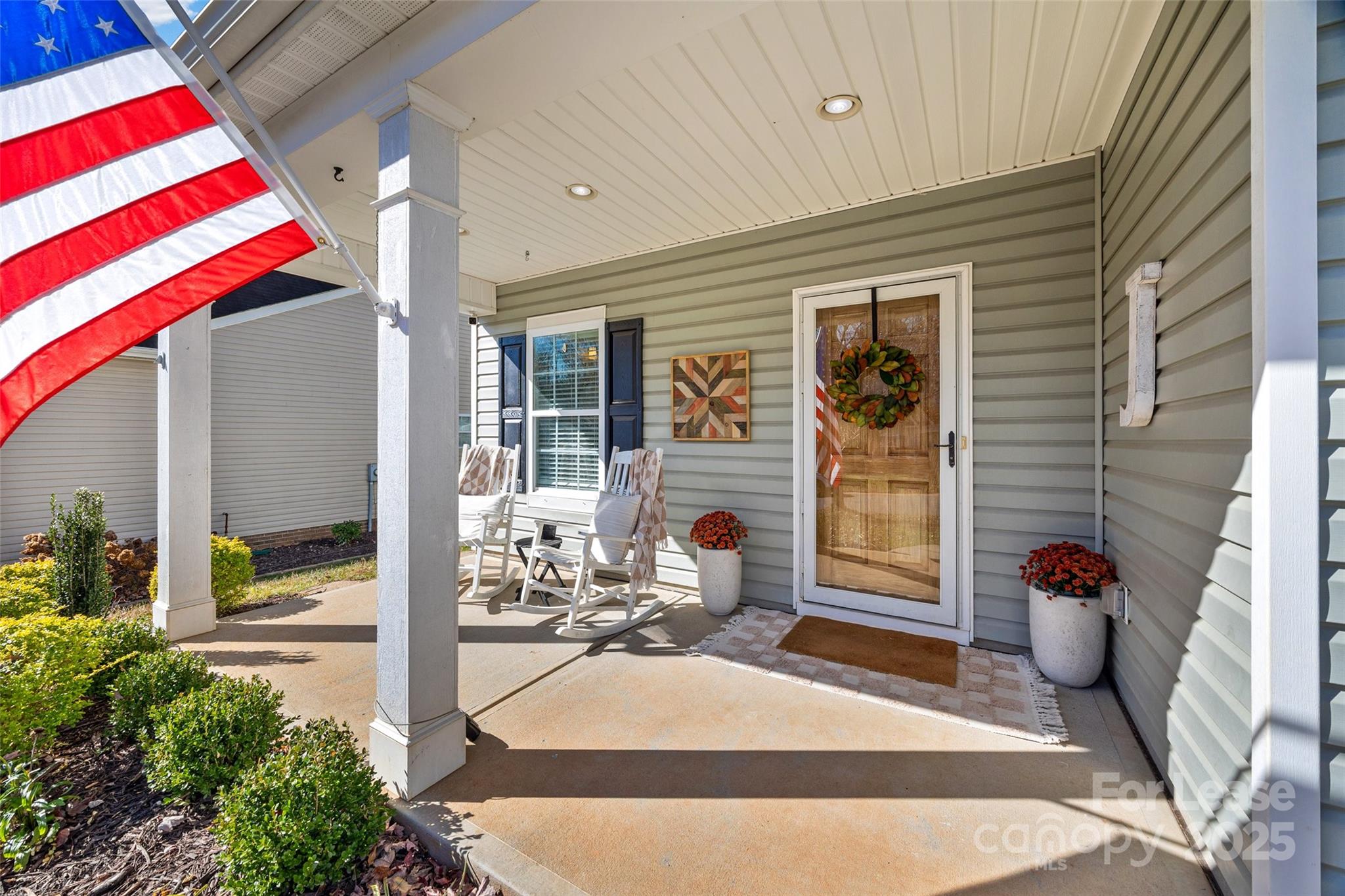 1668 Beleek Ridge Lane Clover, SC 29710 - Photo 2 of 42 a house with potted plants in front of it