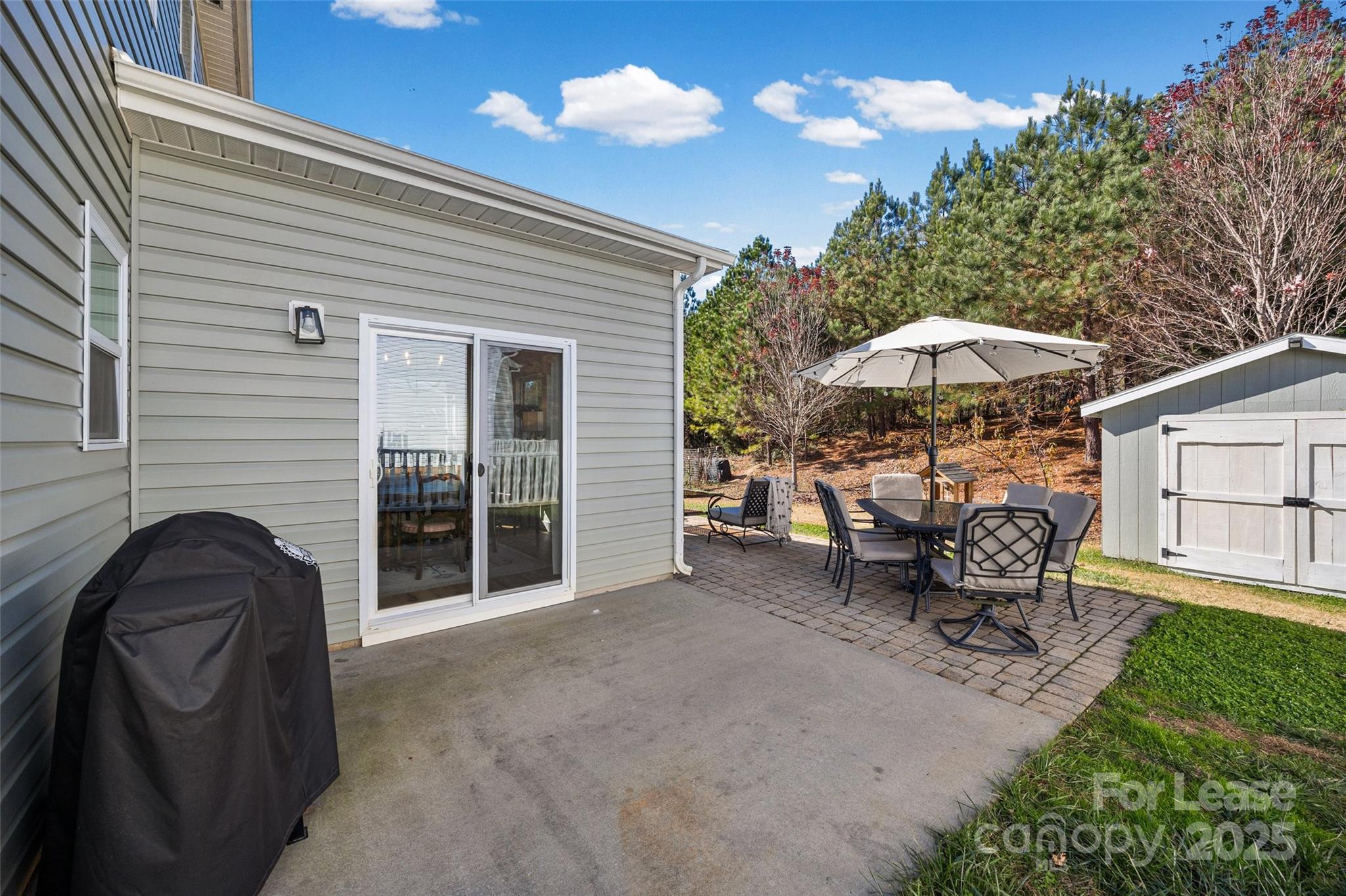 1668 Beleek Ridge Lane Clover, SC 29710 - Photo 28 of 42 a view of a two chairs under an umbrella in patio