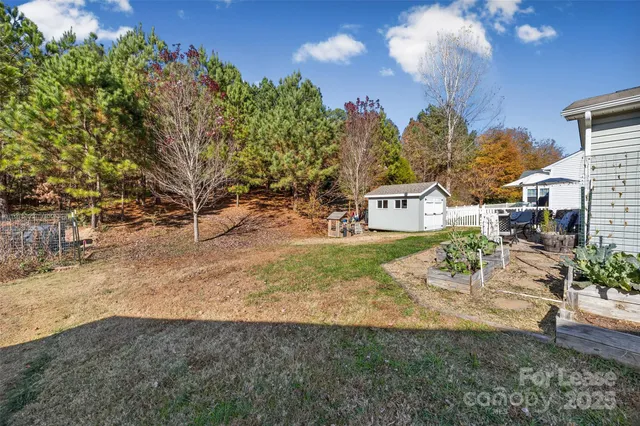 a view of a yard with table and chairs