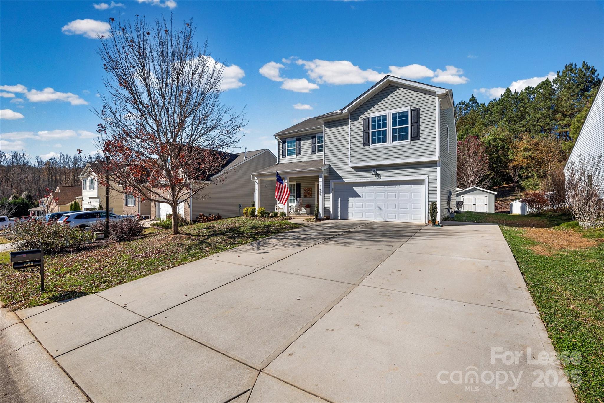 1668 Beleek Ridge Lane Clover, SC 29710 - Photo 33 of 42 a front view of a house with a yard and trees