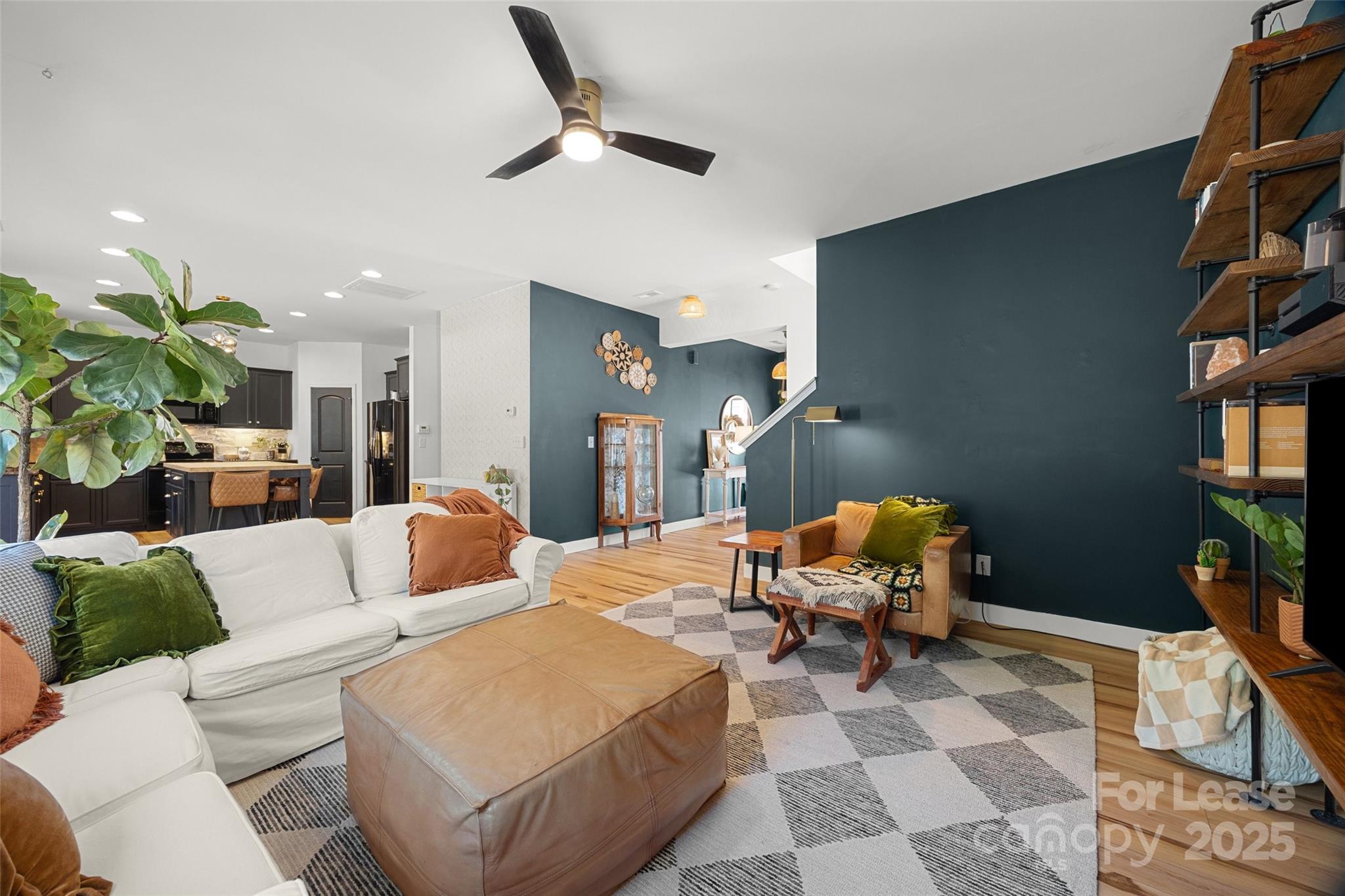 1668 Beleek Ridge Lane Clover, SC 29710 - Photo 7 of 42 a living room with furniture a rug and a potted plant