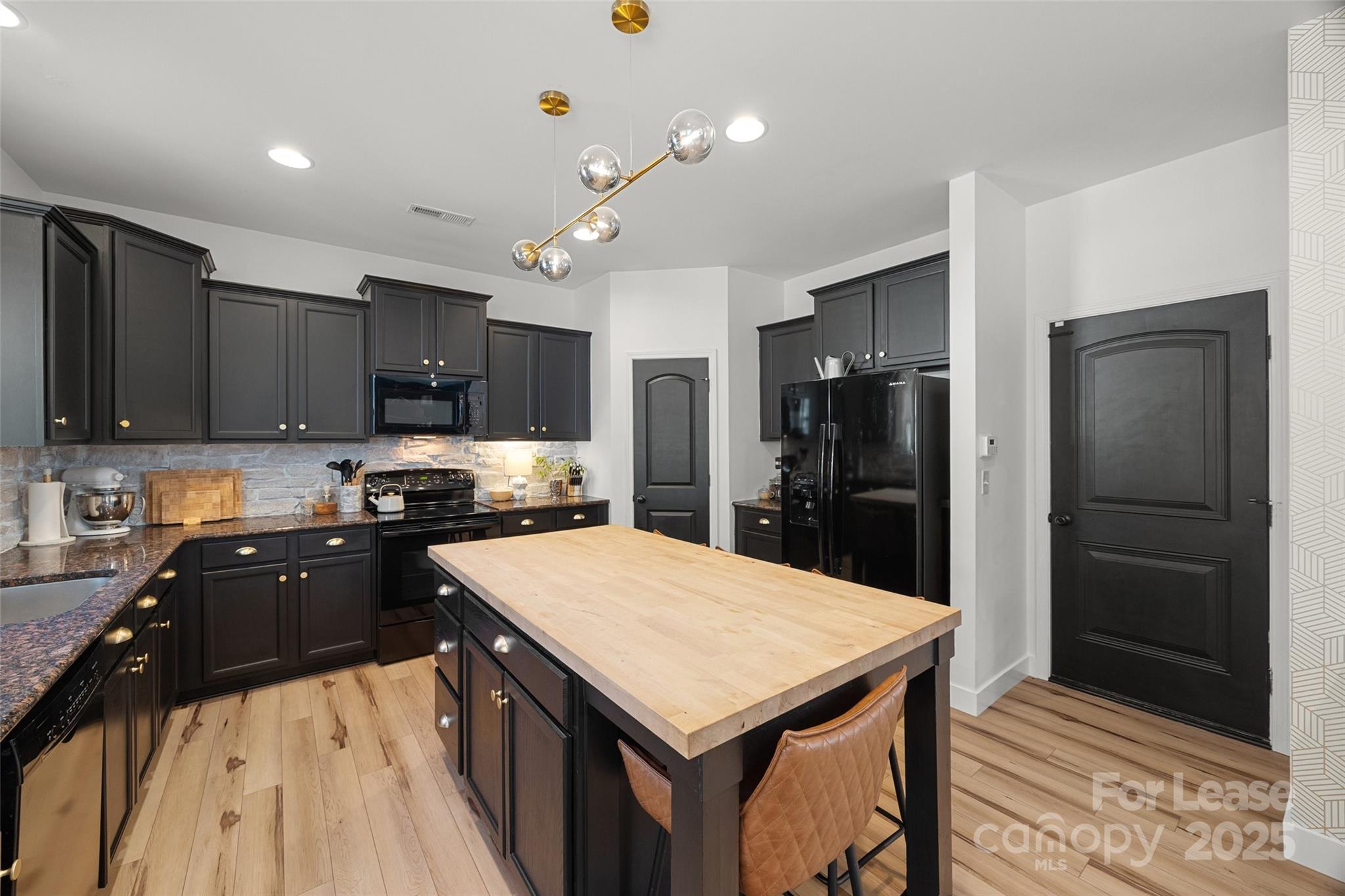 1668 Beleek Ridge Lane Clover, SC 29710 - Photo 8 of 42 a kitchen with a stove a refrigerator and a sink